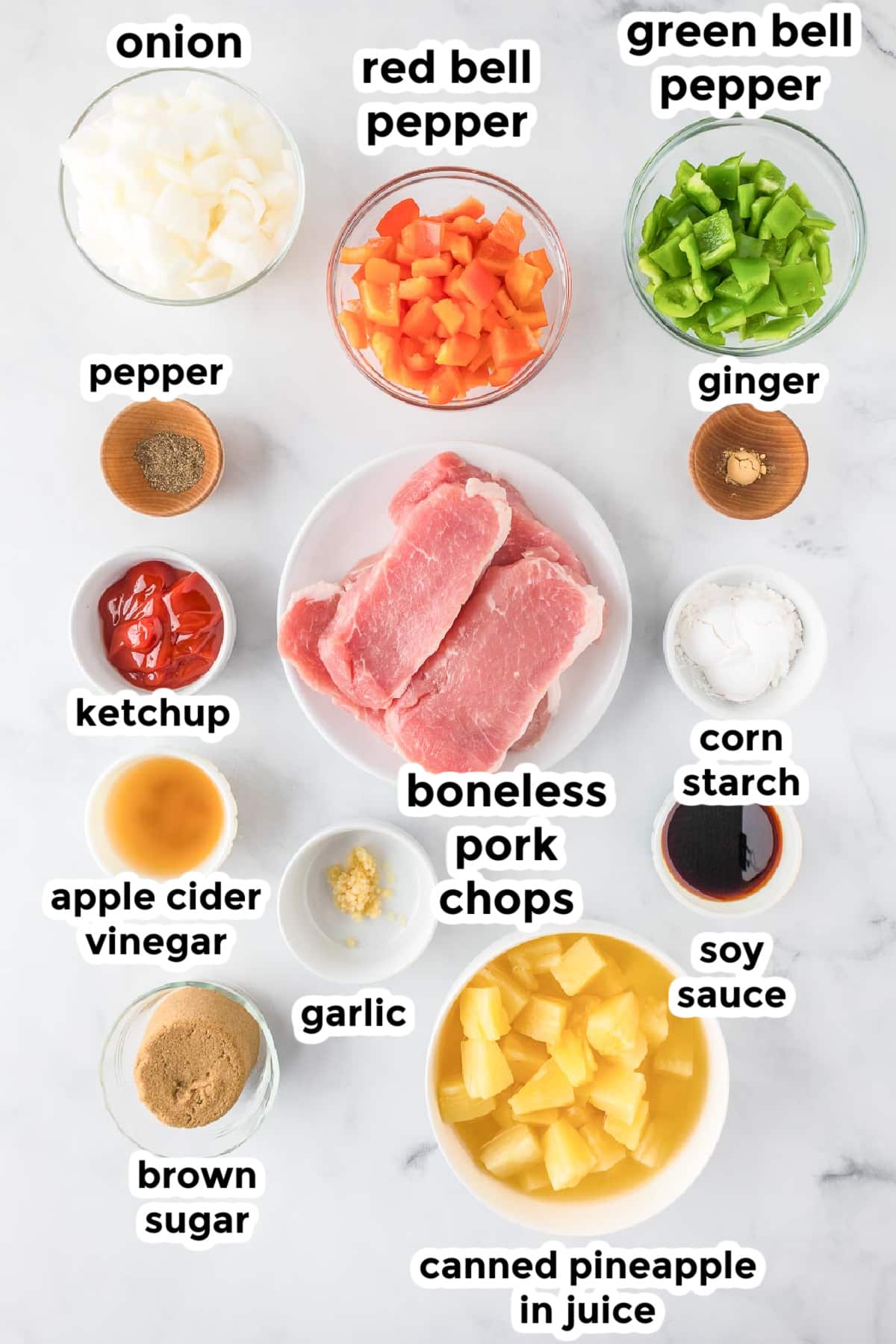 Ingredients for slow cooker sweet and sour pork in bowls on a counter with title text labels.