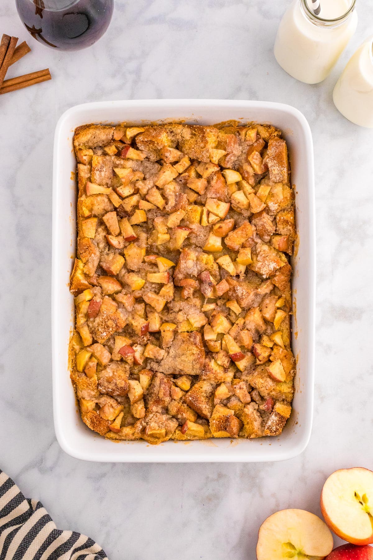 A baking dish containing baked apple french toast casserole after baking.