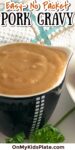 Cup filled with homemade pork gravy with title text across the top of the image.