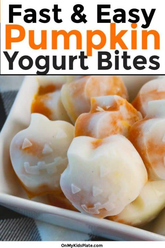 Bowl of pumpkin-shaped yogurt bites with orange and white swirls close up with title "fast and easy pumpkin yogurt bites" across the top of the image.