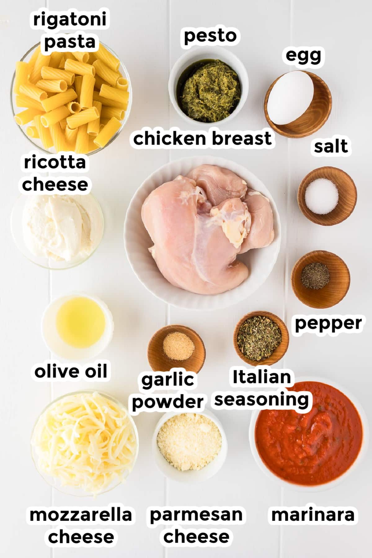 Ingredients for baked rigatoni with chicken in bowls with text title labels.