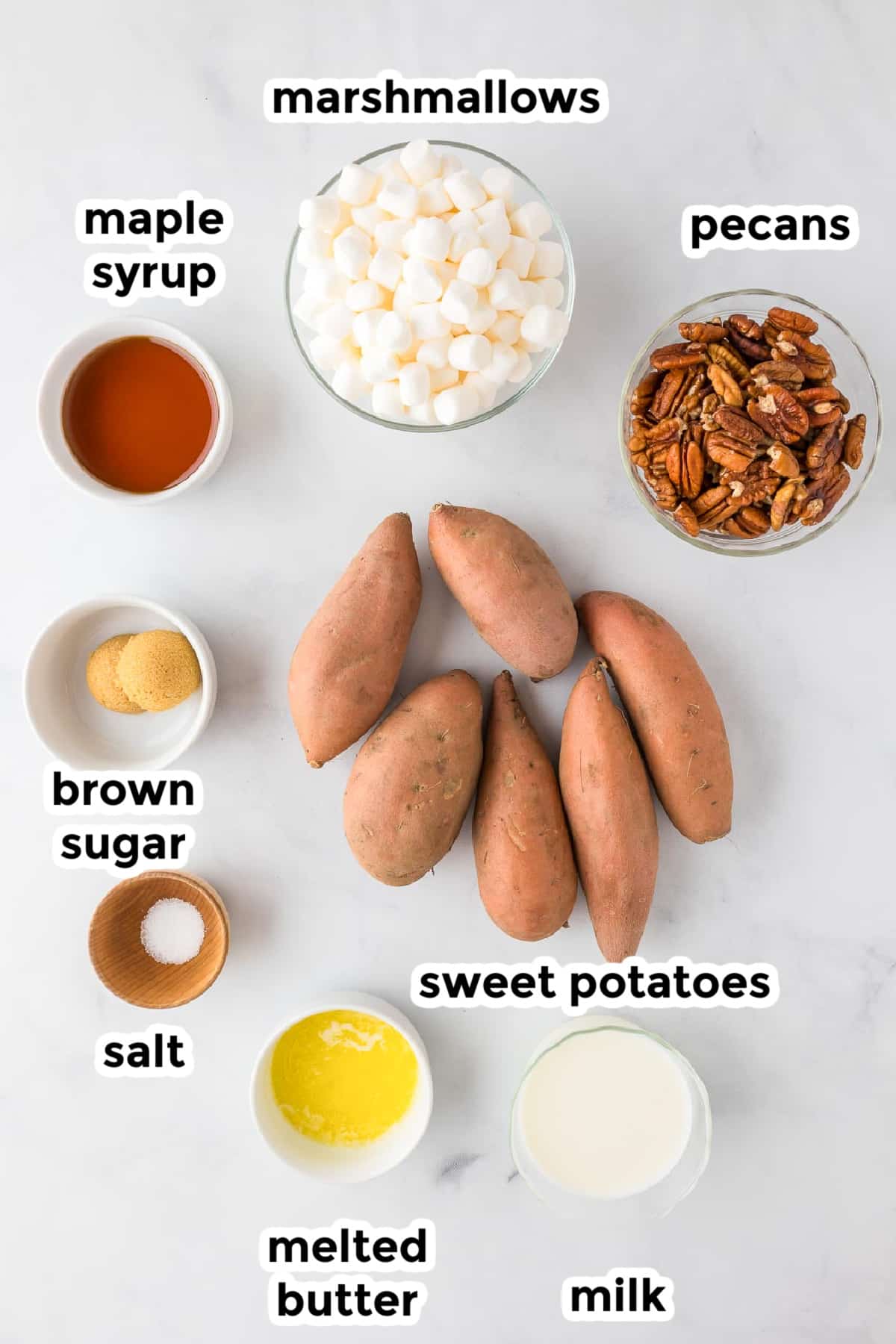 Ingredients for sweet potato casserole on a counter in bowls with text title labels.