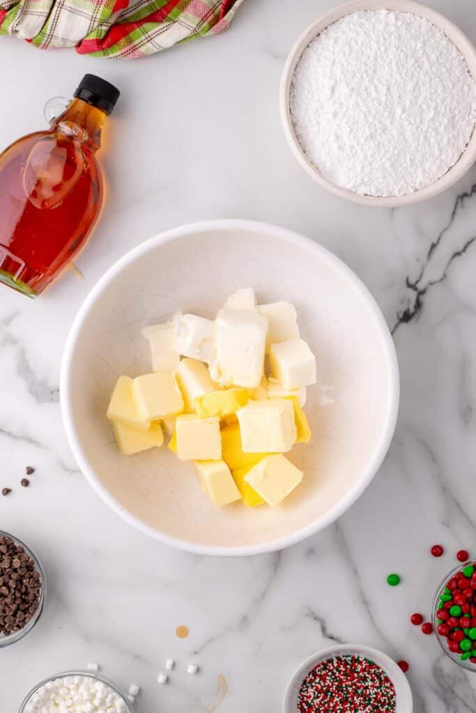 Bowl with butter and shortening cubes for frosting for elf cupcakes ready to be mixed together.