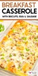 A baked breakfast casserole with biscuits, egg, sausage, and melted cheese in a glass dish with title text over the image.