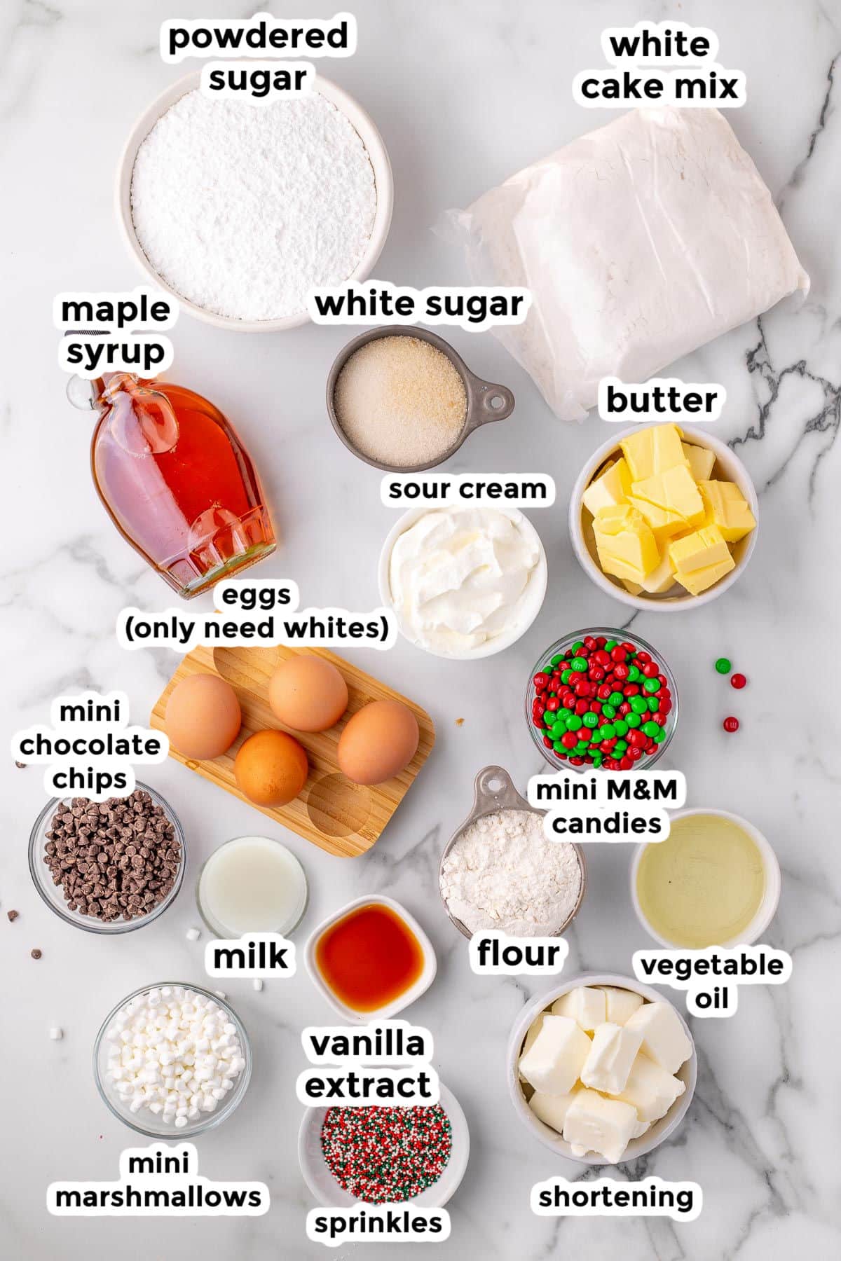 Ingredients for elf's favorite cupcakes on a counter in bowls with text labels.