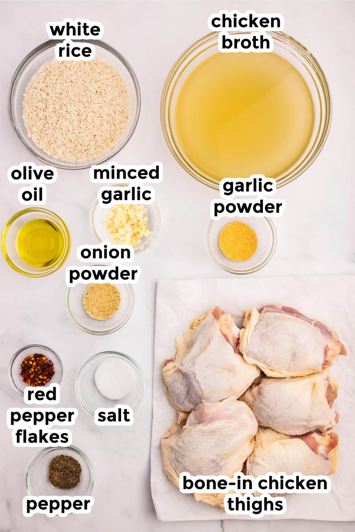 Ingredients for chicken thighs with rice laid out on a counter in bowls with text labels.