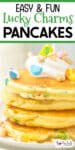 A stack of pancakes topped with whipped cream and colorful Lucky Charms cereal pieces, with title text across the top of the image.