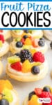 Round fruit pizza sugar cookies topped with white frosting and various fresh fruits including blackberries, blueberries, kiwi, strawberries, and oranges pieces.