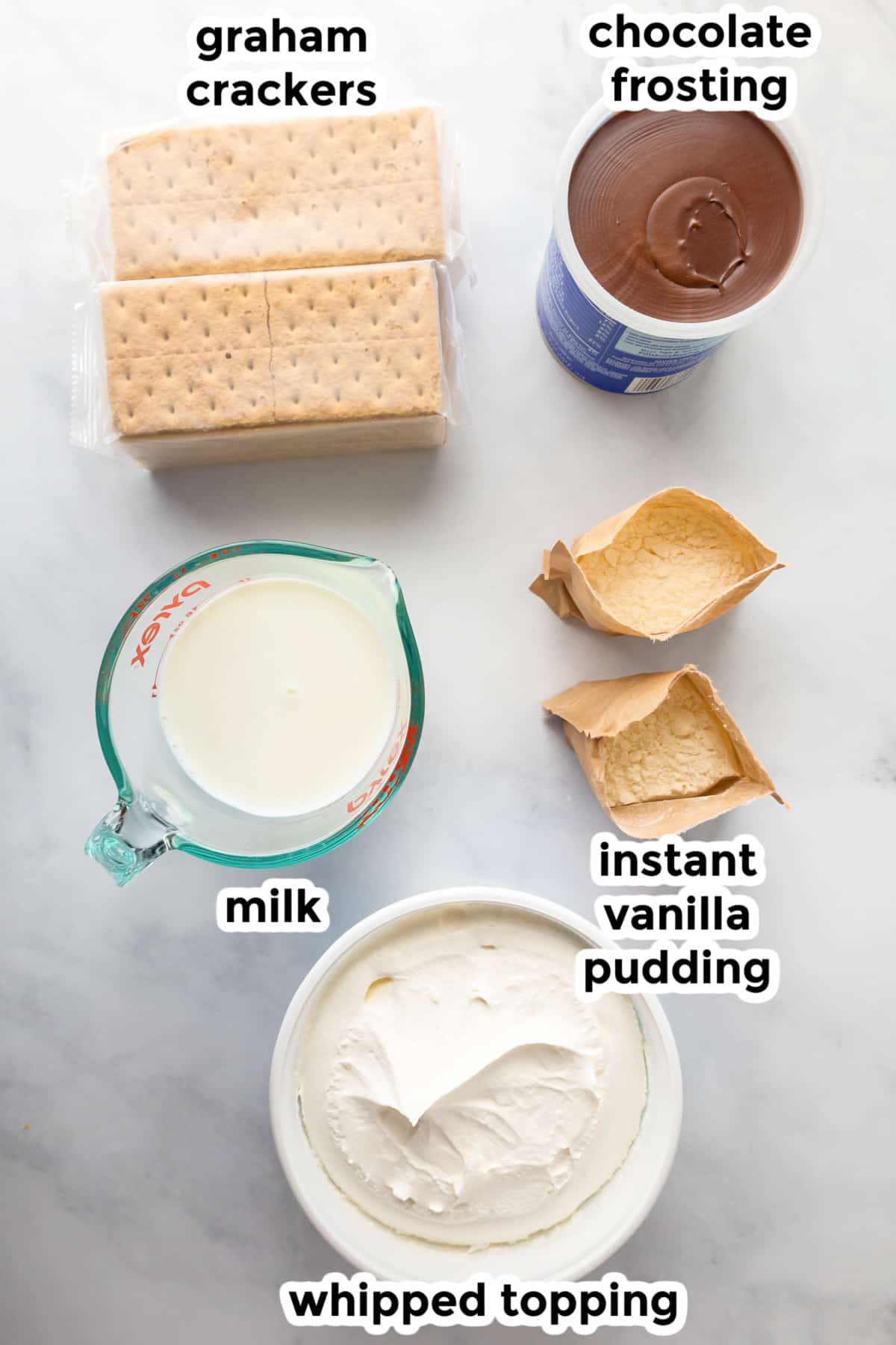 Ingredients for no back chocolate eclair icebox cake on a counter with text labels.