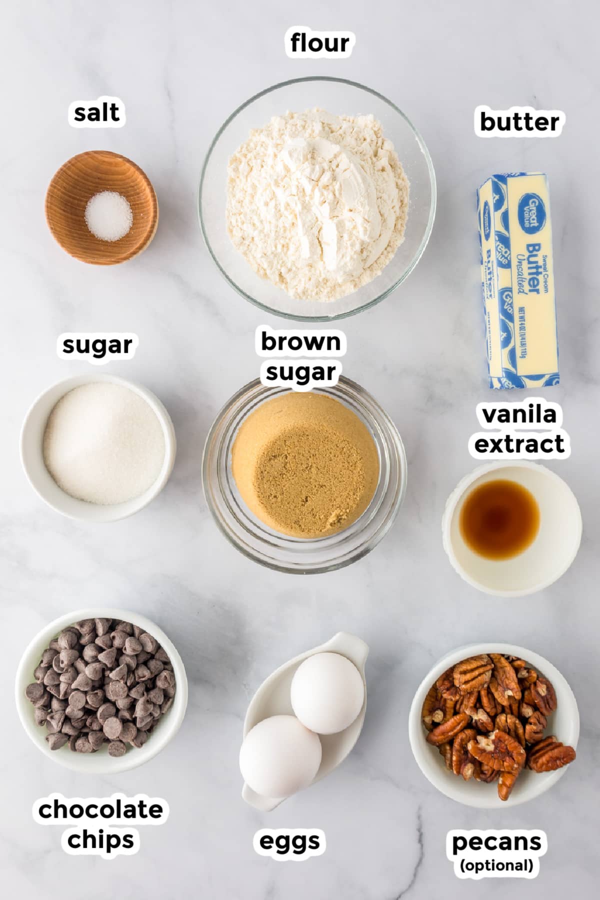 Ingredients for blondies in bowls with text labels on a counter.