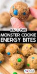 A hand holds a round energy bite with oats and colorful candy-coated chocolates; several similar bites are on a wooden surface below. Text reads, "How to Make Monster Cookie Energy Bites.