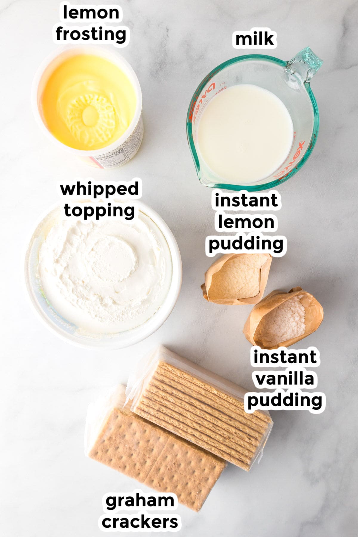 Top-down view of labeled ingredients for a no bake lemon eclair icebox cake.