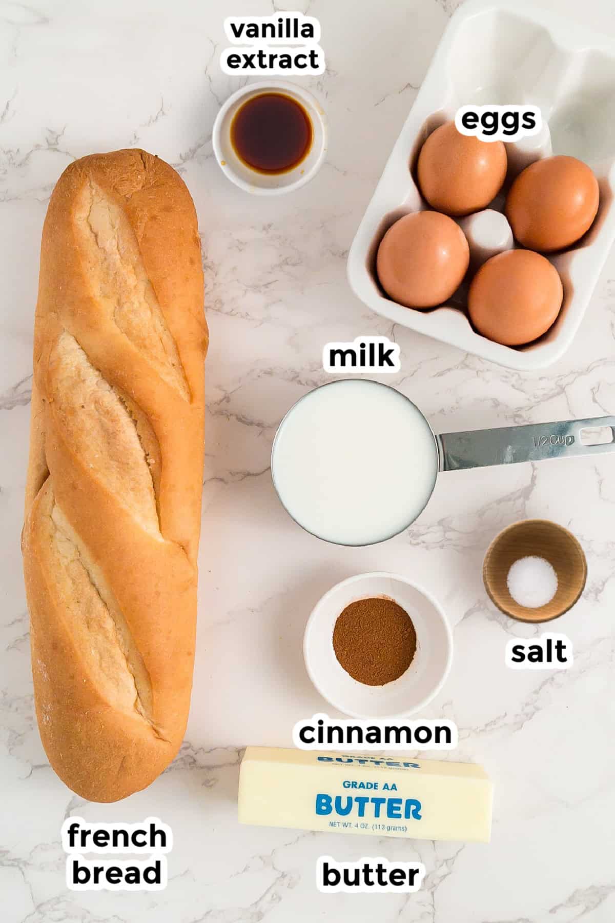 Ingredients for french bread French toast arranged on a counter with text labels.