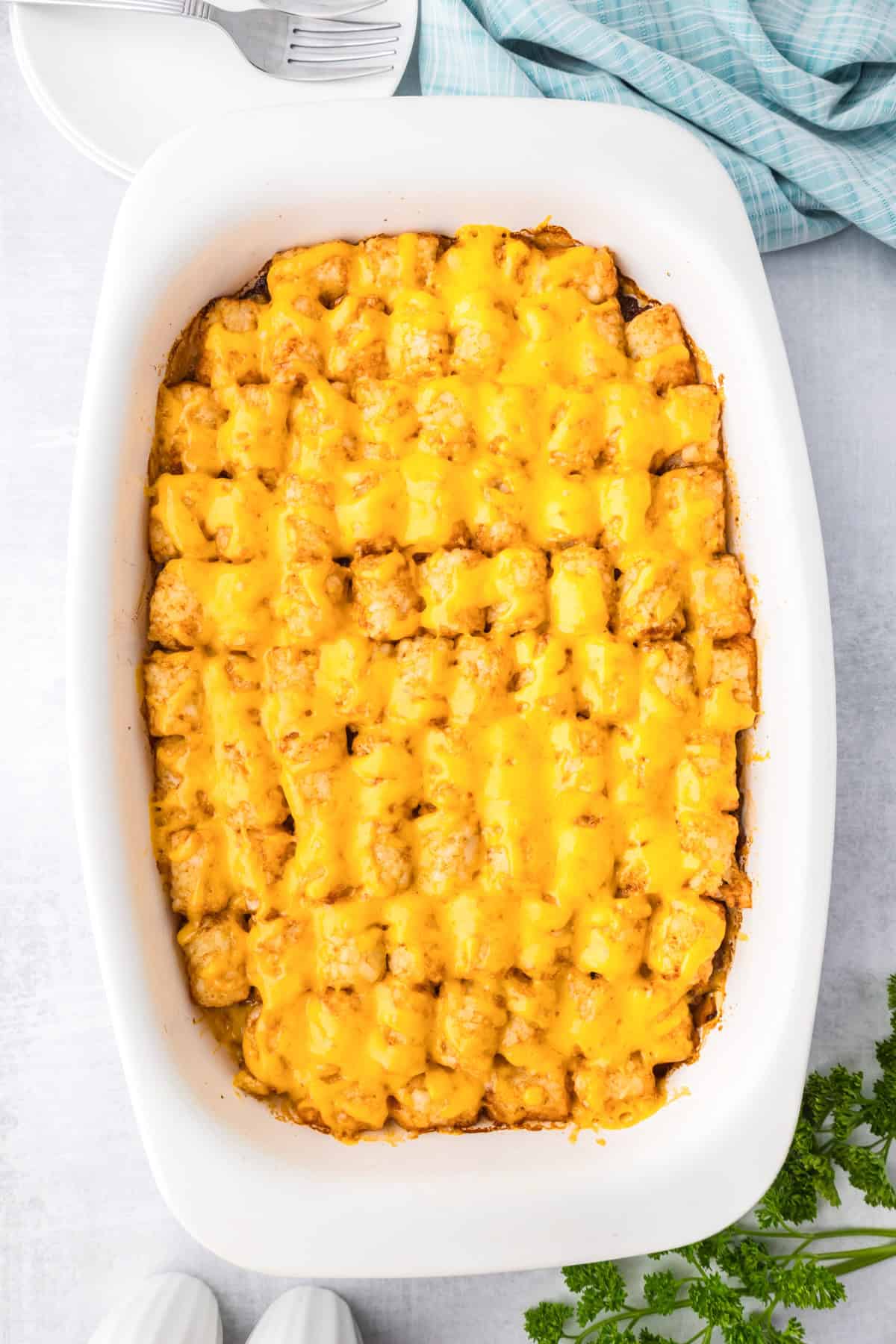 Finished sloppy joe tater tot casserole topped with melted cheese.